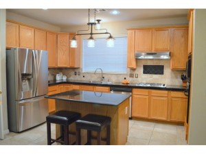 Updated kitchen with stainless steel appliances, granite counter